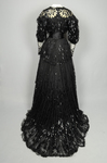 Evening gown, House of Rouff, black silk taffeta and satin with layered black net overlays embroidered with elongated black spangles and round sequins, c. 1905, back view by Irma G. Bowen Historic Clothing Collection