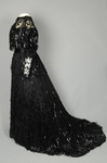 Evening gown, House of Rouff, black silk taffeta and satin with layered black net overlays embroidered with elongated black spangles and round sequins, c. 1905, side view by Irma G. Bowen Historic Clothing Collection