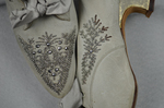 Wedding dress, pale green silk crepe with silver satin, pont d’esprit, and lace, with matching gray shoes with steel-cut beads, 1907, detail of shoes by Irma G. Bowen Historic Clothing Collection