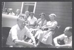 May Gadd and others sitting outside together