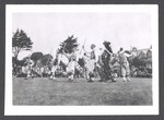 Morris team performing with a Betty and Fool