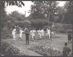 Bampton Morris dancers with Billy "Jinky" Wells in walled garden