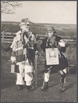 Two people in rag costumes dressed as "The Toms" by Tindale, John
