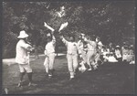Bampton Morris dancers performing outdoors for an audience of ladies