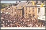 A crowd of people fill the street on Flora Day for the "Helston Floral Dance"
