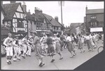 Men and woman dancing in the street