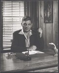 Portrait of Georg Bidstrup sitting at a desk, ca. 1952 by Unknown