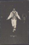 Man dancing dressed in costume by Unknown