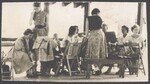 A group of CDSS members gathered around chairs and music stands