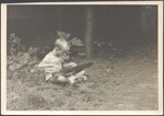 A young boy playing a mountain dulcimer