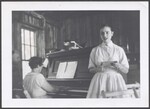 Helene Atler singing while Lyn Elgi plays piano, 1958 by Atler, Milton