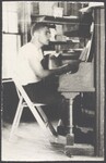 A young man playing piano
