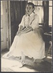Jean Ritchie sitting in a chair