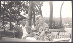 Everett Smith and Lily Conant sitting on a bench together