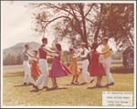 Couples dancing a "Swing Your Partner" Square dance on the Berea College campus