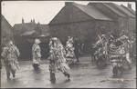 The "Old Time Paper Boys" performing a sword dance