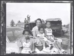 Elsie Margaret Stanton Cobb and daughters sitting on family car, 1955 by Cobb, Ivorey, 1911-1992
