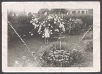 Childhood friend of Elsie Margaret Stanton Cobb in garden by Unknown