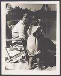 Elsie Margaret Stanton Cobb and Gretel Anne Cobb smiling while at the beach, ca. 1948 by Unknown