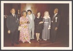 Ivorey and Elsie Cobb standing with other celebration attendees by Unknown