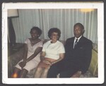 Elsie and Ivorey Cobb sitting on couch with unidentified person, August 1, 1967 by Unknown