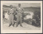 Kim, Dong Ho and Kim, Youngdahl standing together, August 1951 by Cobb, Ivorey, 1911-1992