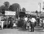 Elsie Margaret Stanton Cobb, Marilyn Eva Cobb, Gretel Anne Cobb and Louise Minerva Cobb standing at a ticket booth in Venice by Unknown