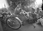 Elsie Margaret Stanton Cobb with daughters Marilyn, Gretel and Louise with Christmas tree by Unknown