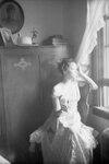 Elsie Margaret Stanton Cobb poses in a chair wearing a sleeveless dress by Unknown