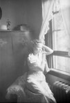 Elsie Margaret Stanton Cobb poses in a chair by an open window by Unknown