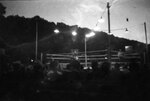 Boxing arena at night by Unknown