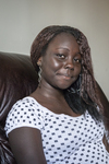 Young South Sudanese Woman at Home by Becky Field