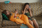 Young Bhutanese Women on Cell Phones, 2012 by Becky Field