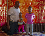 Somali Father and Daughters at Home, 2017 by Becky Field