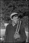 Young man carrying axes in Michurinsk, Russia, USSR, ca. 1932-1933 by Jacobi, Lotte, 1896-1990