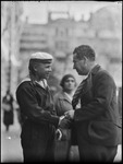 Egon Erwin Kisch, an Austrian and Czechoslovakian writer and jourlist shaking hands with a sailor on a street in Moscow, Russia, USSR, ca. 1932 by Jacobi, Lotte, 1896-1990