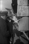 Two men browsing a street stand in Moscow, Russia, USSR, ca. 1932-1933 by Jacobi, Lotte, 1896-1990