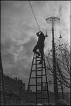 Man on a ladder in Moscow, Russia, USSR, ca. 1932-1933 by Jacobi, Lotte, 1896-1990