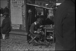 Shoe repairman working on a street in Moscow, Russia, USSR, ca. 1932-1933 by Jacobi, Lotte, 1896-1990