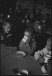 Children in a school sitting together at a table in Moscow, Russia, USSR, ca. 1932-1933 by Jacobi, Lotte, 1896-1990