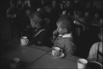 Children in a school sitting together at a table in Moscow, Russia, USSR, ca. 1932-1933 by Jacobi, Lotte, 1896-1990