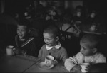 Children in a school sitting together at a table in Moscow, Russia, USSR, ca. 1932-1933 by Jacobi, Lotte, 1896-1990