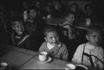 Children in a school sitting together at a table in Moscow, Russia, USSR, ca. 1932-1933 by Jacobi, Lotte, 1896-1990