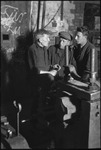 Three factory workers talking in Moscow, Russia, USSR, ca. 1932-1933 by Jacobi, Lotte, 1896-1990