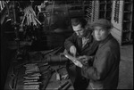 Two men working in a factory in Moscow, Russia, USSR, ca. 1932-1933 by Jacobi, Lotte, 1896-1990