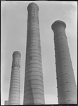 Smokestacks from the Hammer and Sickle factory pictured against the sky in Moscow, Russia, USSR, ca. 1932 by Jacobi, Lotte, 1896-1990