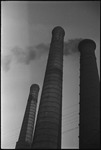 Smokestacks from the Hammer and Sickle factory pictured against the sky in Moscow, Russia, USSR, ca. 1932 by Jacobi, Lotte, 1896-1990