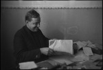 Smiling man at his desk in Russia, USSR, ca. 1932-1933 by Jacobi, Lotte, 1896-1990