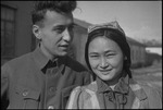 Young couple on the street in the USSR, ca. 1932-1933 by Jacobi, Lotte, 1896-1990