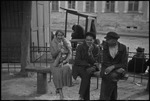 Two men and a woman sitting on a park bench in the USSR, ca. 1932-1933 by Jacobi, Lotte, 1896-1990